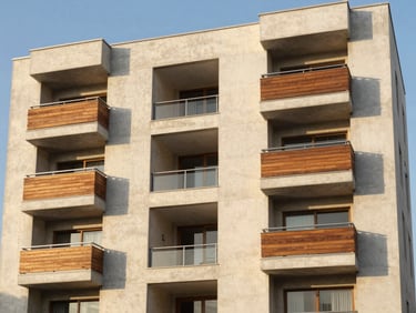 Modern five-story residential building facade in Tacna, clean concrete finishes, geometric balconies, golden hour sunlight