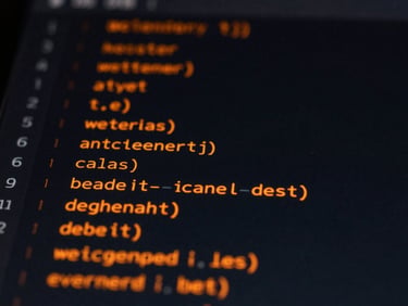 Macro shot of a clean code interface on a dark screen with vibrant orange data lines, high-contrast low-key lighting, technical atmosphere