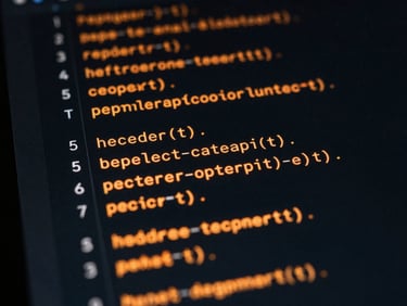 Macro shot of clean code interface on a dark screen, glowing orange data lines illuminating the lines of code, dark editorial technology photography, high-contrast low-key lighting