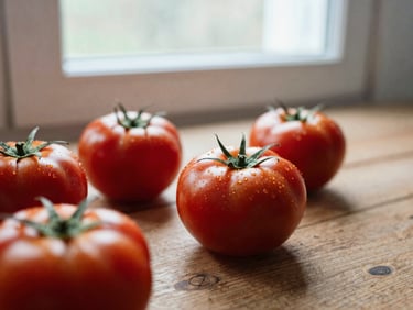 Extreme close-up of fresh red tomatoes on a rustic wooden table, soft natural window light, Scandinavian minimalist composition, 35mm