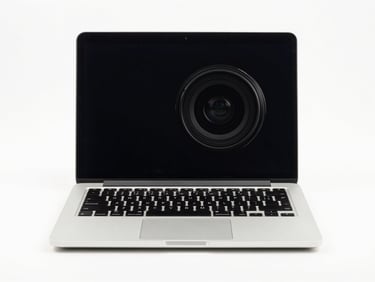 Centered straight-on studio shot of an open silver laptop on a clean white background, bright even lighting