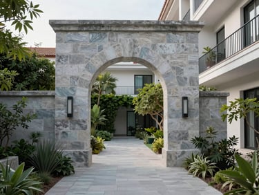 Monolithic stone archway in a boutique hotel courtyard in Valladolid, lush courtyard garden, quiet afternoon light