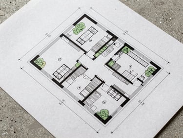 Close-up of architectural site plan showing property setbacks, zoning lines, and precise technical dimensions on concrete background.