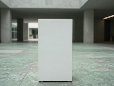 Straight-on eye-level shot of a tall rectangular matte white fibre planter in a modern concrete atrium with soft diffused overcast light.