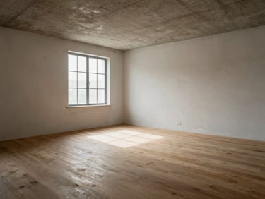 Empty completed interior space — raw plaster walls, exposed concrete ceiling, unfinished timber floor, no furniture or staging — photographed from a wide environmental angle under north-facing window light, the spatial proportions readable as a deliberate structural decision