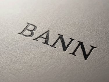 Extreme close-up of premium textured matte paper with embossed typography, dramatic side lighting.
