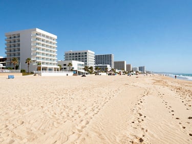Nisipurile de Aur beach with golden sand, modern family hotels along the promenade, bright midday sun