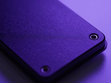 Macro photography of secure hardware security module with deep violet and indigo ambient backlighting, sharp technical focus