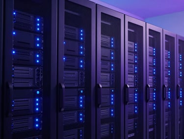 Clean server environment with rows of server racks, glowing blue and indigo indicator lights, precise architectural geometry, cool studio lighting.