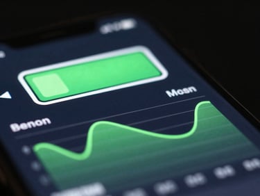 Extreme close-up of a mobile screen showing a clean battery optimization graph, neon green accents, dark background.
