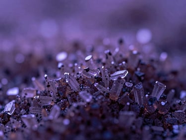 Macro close-up of magnesium crystals, moody editorial photography, soft purple ambient twilight, shallow depth of field