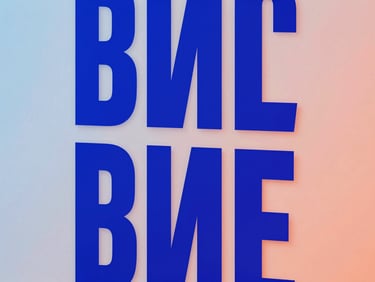 Extreme close-up of a bold graphic design poster mockup on a clean studio wall, electric blue gel lighting, sharp grotesque typography, 35mm