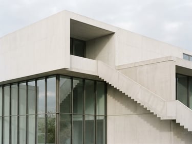 Minimalist concrete structure with clean geometric lines, sharp morning shadows, overcast light, architectural photography