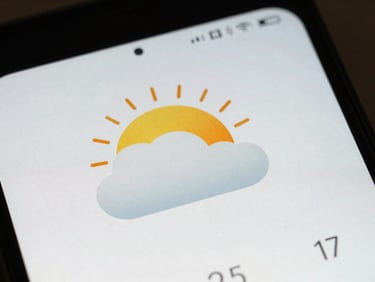 Macro shot of a minimalist weather and clock widget on an Android screen, soft side-lighting, 35mm lens