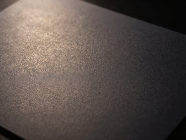 Close-up of a discreet, official-looking document, subtle texture, dark background, professional lighting.