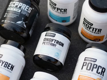 Clean flat-lay of sports nutrition supplements, focus on a clean ingredient label, high-contrast natural daylight