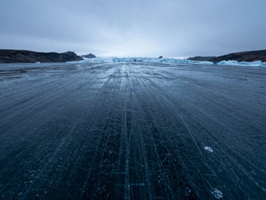 Extreme macro close-up of pure arctic glacier ice texture, fine frozen lines, cold blue light, high contrast