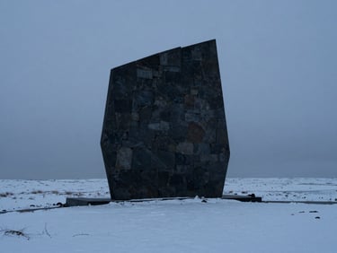 A single dark monolithic stone structure rising from a snowy landscape, stark contrast, cold diffused daylight, minimalist composition.