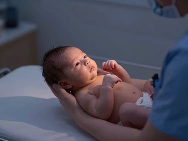 A professional newborn care specialist in dim, warm twilight lamp light gently rocking a peaceful baby, shallow depth of field, 35mm