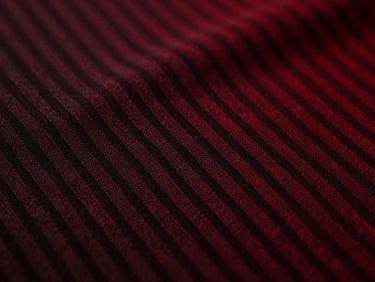 Macro shot of moisture-wicking fabric texture, showing intricate weave, dramatic high-contrast chiaroscuro lighting, sharp focus.