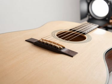 Close-up of premium acoustic guitar strings and bridge, pristine wood grain, studio key light