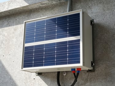 Close-up of a robust solar inverter unit mounted on a concrete wall, wiring neatly routed, bright natural light.