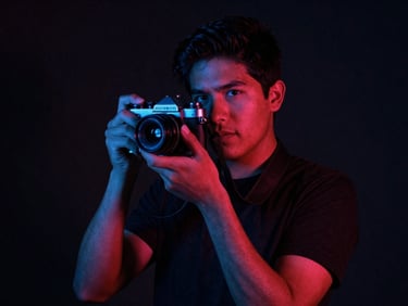 Moody low-light portrait of a young Mexican film director holding a vintage camera, harsh shadows, neon blue accent lighting