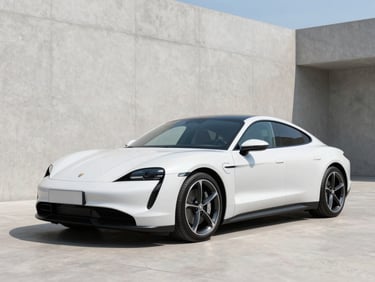 Three-quarter view of a sleek white electric sports car, bright natural daylight, clean minimalist concrete backdrop.