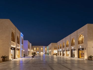 Architectural shot of a modern, clean Omani market or shopping district at twilight, with subtle neon blue accents, wide-angle, crisp details.
