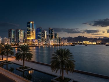 Wide panoramic view of modern Muscat skyline at twilight, sleek glass facades reflecting the last light, a few prominent palm trees in the foreground, high-end corporate photography, crisp twilight architectural lighting, deep navy and gold tones, sharp focus, 35mm