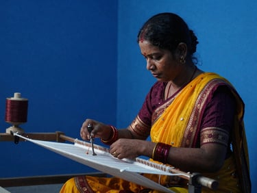 A cinematic shot of a cultural documentary film set in Bangladesh, dramatic key lighting showing traditional weavers at work