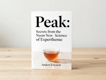 Minimalist book cover of 'Peak: Secrets from the New Science of Expertise' by Anders Ericsson, on a light wooden table with a single tea cup, soft morning light.