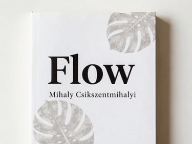 Clean white book cover of 'Flow' by Mihaly Csikszentmihalyi, with subtle botanical shadows of a monstera leaf, soft diffused daylight, flat lay.