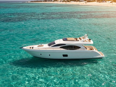 A sleek, twin-deck luxury yacht with comfortable seating on deck, cruising on crystal-clear turquoise Red Sea waters under a bright morning sun. Shallow depth of field, 35mm.
