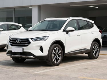 Three-quarter view of a clean white midsize SUV parked on concrete under soft daylight, 35mm lens
