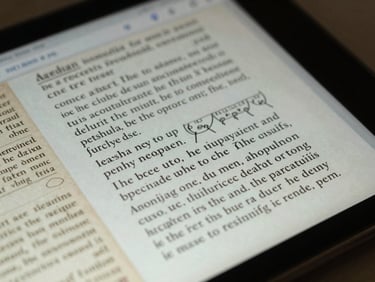 Macro close-up of a digital interface showing scholarly manuscript annotations, cool-toned lab lighting, high-contrast text.
