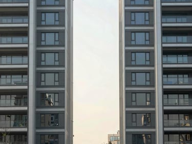 Symmetrical structural columns of a modern high-end estate, soft diffused morning light, clean lines, 35mm