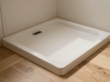 Close-up of a textured matte shower tray flush with the wooden floor, warm natural light, elegant bathroom interior