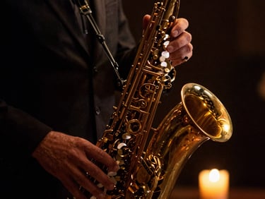 Close-up of hands on brass saxophone keys under soft golden-hour stage lighting, dark background, rich texture