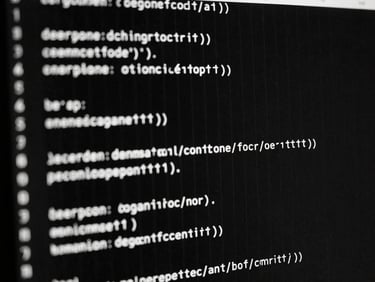 Close-up of clean code lines glowing faintly on an ultra-dark monitor, sharp vertical lines, dramatic low-key lighting