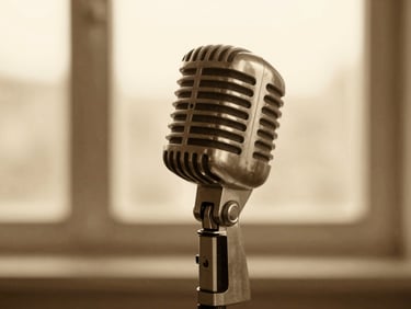 Close-up of a vintage microphone on a stand, warm side-lighting, soft focus background, sepia tones