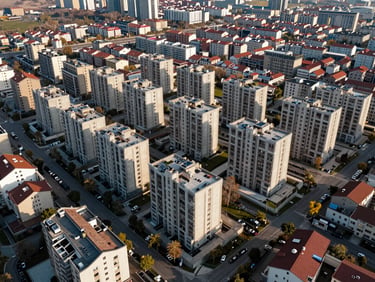 Aerial view of a prime residential investment plot in İpekyolu, Van, surrounded by modern low-rise developments, soft natural daylight.