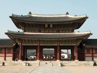 Gyeongbokgung Palace gate in Seoul photographed frontally in bright even daylight, clean sky, architectural precision, calm institutional light, no tourism drama