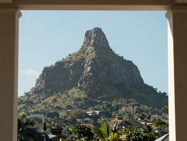 Le Morne Brabant mountain in Mauritius photographed frontally in bright even daylight, clean sky, calm architectural framing, no tropical tourism warmth, institutional tone