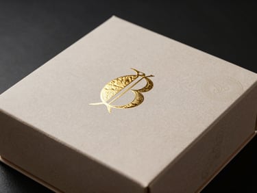 Luxury artisanal food box with gold foil details, gourmet curation, high-contrast studio lighting.