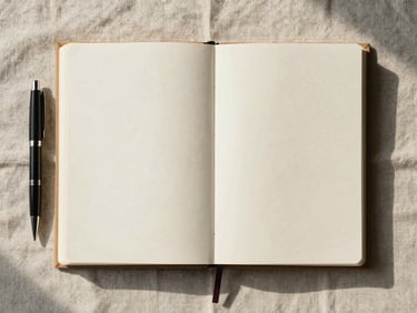 Wide overhead flat-lay of a finished manuscript stack beside a closed notebook and a pen on a textured linen desk surface, soft north-facing daylight, clean and settled composition, no hands in frame