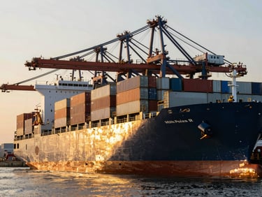 Industrial cargo ship loading steel containers at a modern port terminal, golden hour lighting, cinematic reflections