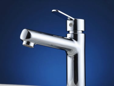 Close-up of a high-quality, modern chrome water mixer faucet, highlighting its finish and craftsmanship, studio lighting, deep blue and metallic tones, high contrast.