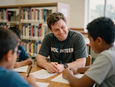 Candid medium shot of a warm Ohio volunteer mentoring a young student in a local library, soft natural daylight, authentic interaction, 35mm film aesthetic