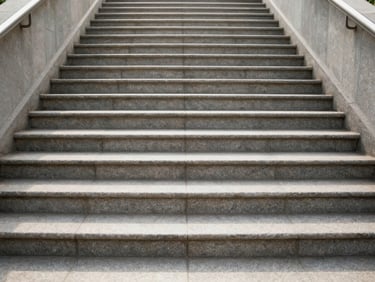 Symmetrical shot of a spotless, freshly mopped stone stairwell in bright morning light, clean lines, professional finish